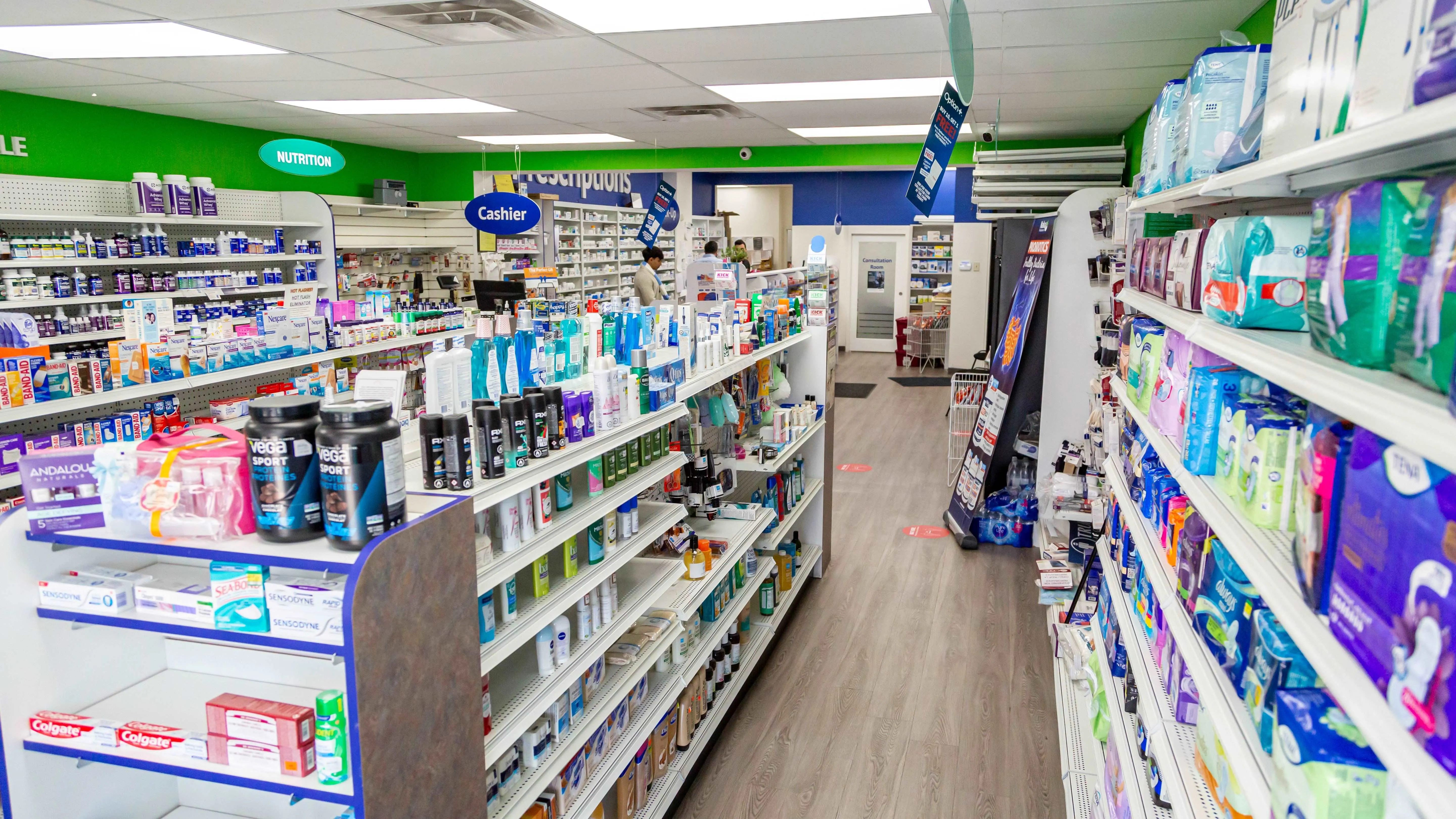 A bright aisle inside Madill Health Aid Pharmacy